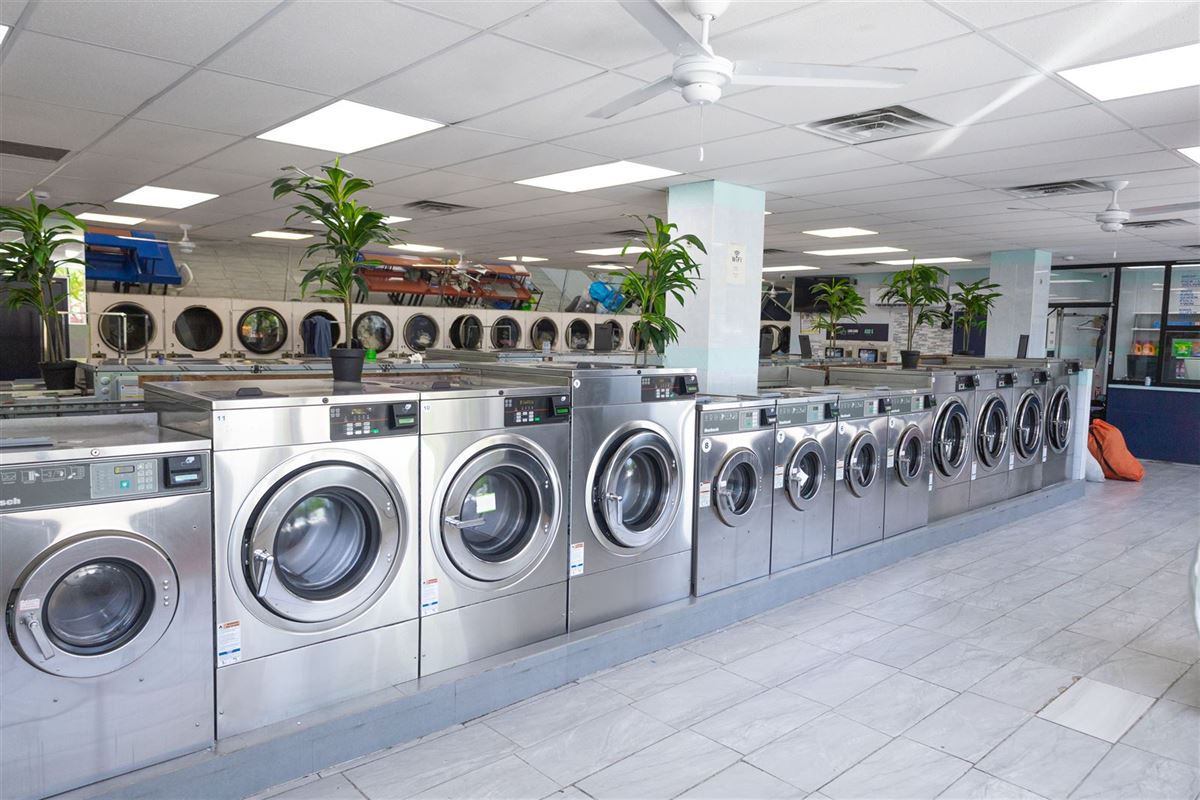 Row of Speed Queen washers inside Neatly, 2333 Hylan Blvd