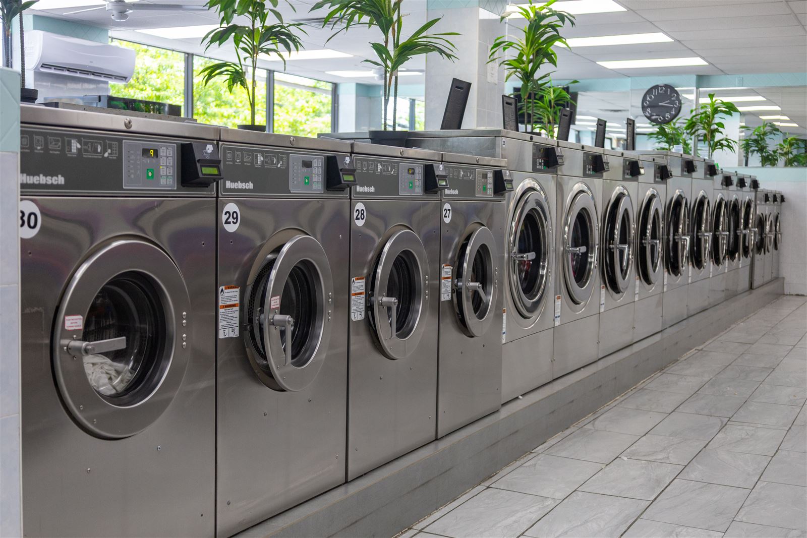 Row of large Huebsch washers at the Neatly laundromat on Hylan Blvd in Staten Island