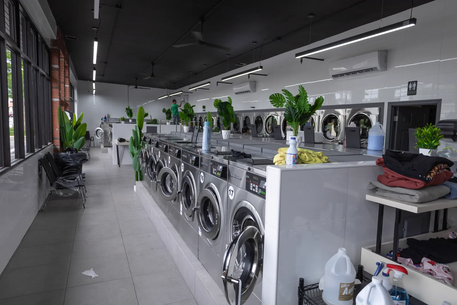 Large-capacity Speed Queen washers beside the folding counter inside Neatly, 1936 Victory Blvd