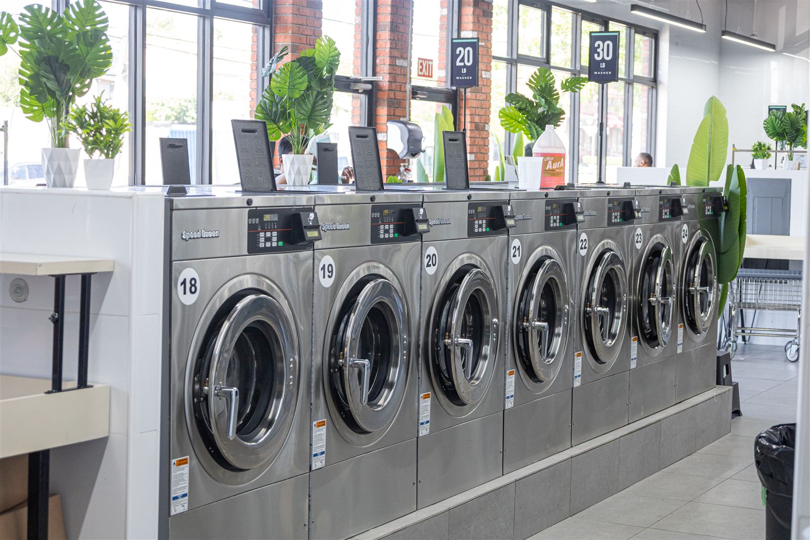 Speed Queen self-service washers in 20 lb to 80 lb sizes at Neatly Laundromat Victory Blvd